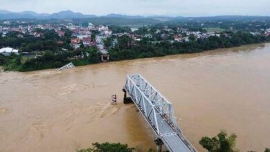 Cars plunge into river as super typhoon destroys Vietnam bridge